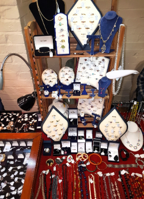 A jewellery stall including rings and necklaces