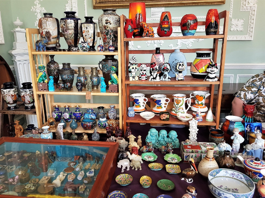 An antiques stall brimming with vases and other ceramic and decorative items