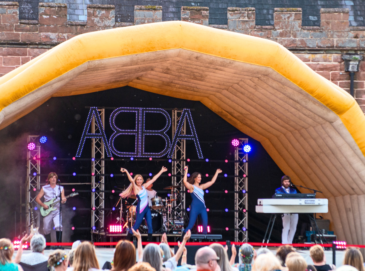 ABBA tribute band performing onstage at Hartlebury Castle