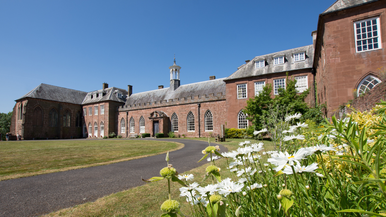 Exterior of Hartlebury Castle with flowers in the foreground