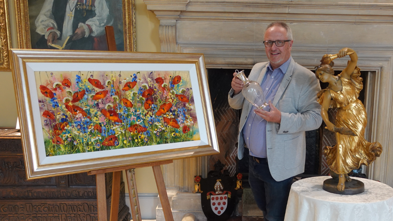 Antiques specialist Mark Hannam with antiques in the Great Hall