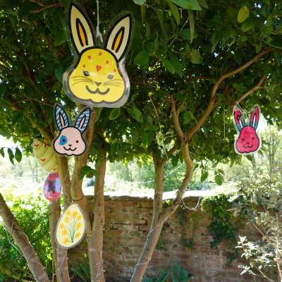 Bunny face plastic decorations hanging on a tree