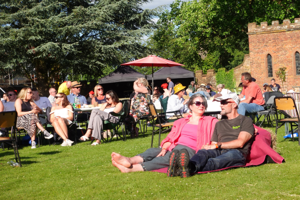 A crowd relaxing outside at Hartlebury Castle