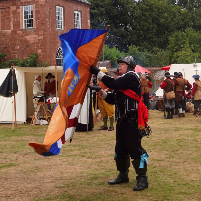 Civil War re-enactor flag twirling outside Hartlebury Castle