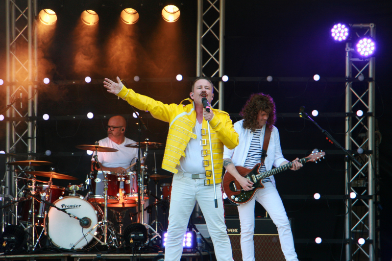 Queen tribute band performs onstage