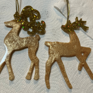 Two gold resin deer Christmas decorations