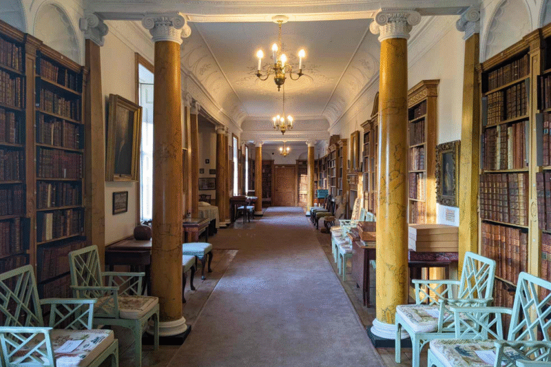 Interior of the Hurd Library with its long corridor, columns and bookshelves